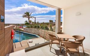 Superior Family Suite Swim Up room in Insotel Punta Prima Resort