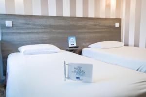 Hotels Kyriad Valenciennes Sud - Rouvignies : Chambre Lits Jumeaux avec Lit d’Appoint - 301