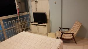 A melhor vista de Santos para 5 pessoas pé na areia