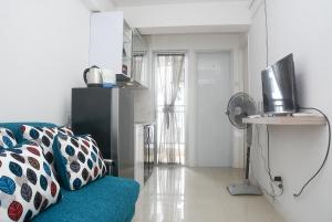 Minimalist and Stylish 1BR Bassura City Apartment By Travelio