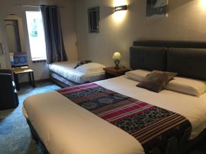 Hotels Logis Hotel Oasis : photos des chambres