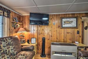 Riverfront Grayling Retreat with Fire Pit and Dock!