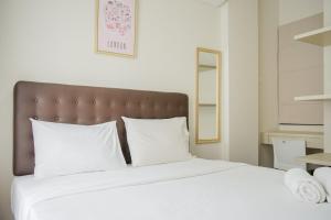 Elegant and Relaxing 1BR Asatti Apartment BSD By Travelio