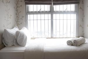 Homey and Chic 2BR Apartment Newton Residence Bandung By Travelio