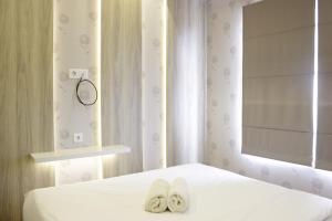 Homey and Chic 2BR Apartment Newton Residence Bandung By Travelio