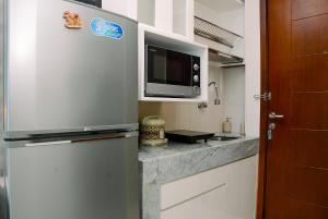 Best Location and New Furnished at Studio Apartment Capitol Park Residence By Travelio