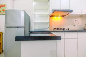 Furnished Green Pramuka 1BR Apartment with Modern Style and City View By Travelio