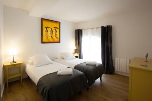 Appartements Place du Palais : photos des chambres