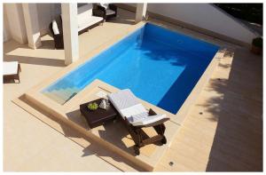 Luxury Beachfront Villa Primosten Oasis with private pool at the beach in Primosten