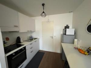 Appartements T1 bis 35 m2 lit queen size tout equipe : photos des chambres
