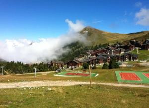 Studio cosy à Mâcot-la-Plagne 24 m² avec vue montagne