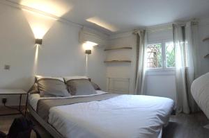 Appartements Appartement d'une chambre avec piscine partagee jacuzzi et jardin clos a Launaguet : photos des chambres