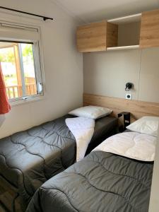 Campings Team Holiday - Camping du Petit Pont : photos des chambres