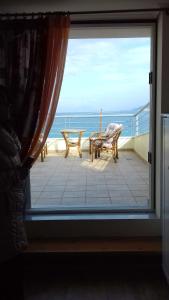 House with 3 bedrooms in Kiato with wonderful sea view and furnished balcony 100 m from th Korinthia Greece
