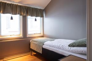 Three-Bedroom Apartment room in Hotel B&B Gränden