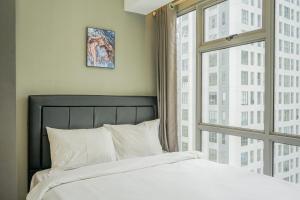 Comfortable and Homey 2BR Apartment at M-Town Residence By Travelio