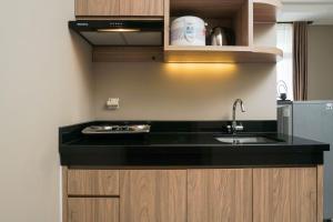 Cozy and Wonderful 1BR Ciputra International Apartment By Travelio