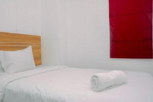 Furnished and Relaxing 2BR Bassura City Apartment near Mall By Travelio