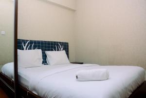 Beautiful 2BR with Direct Access to Pool Green Bay Pluit Apartment By Travelio