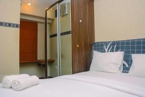 Beautiful 2BR with Direct Access to Pool Green Bay Pluit Apartment By Travelio
