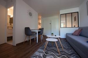 Appartements Ma Location Sablaise - Appart' Les Pins : photos des chambres