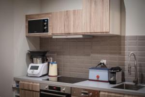 Appartements room five - parking, balneotherapie, place nationale, un havre de paix : photos des chambres