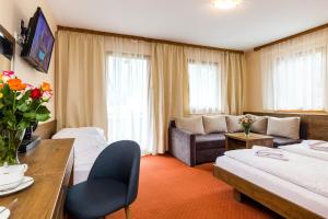 Standard Triple Room with Balcony room in Hotel Post Fusch