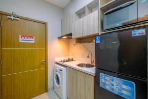 Homey and Warm Studio Apartment Oasis Cikarang By Travelio