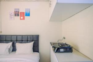 New Room Studio at Green Pramuka City Apartment By Travelio