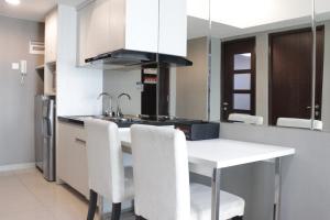 Pleasant and Homey 2BR Apartment at Tamansari La Grande By Travelio