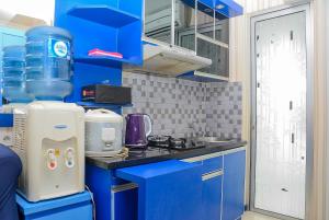 Spacious and Comfy 2BR Bassura City Apartment By Travelio