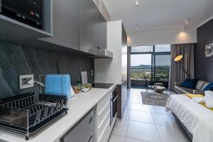 Top Floor Menlyn Maine studio apartment with Stunning Views & No Load Shedding