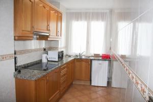 Three-Bedroom Apartment room in APARTAMENTS COLELLS
