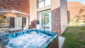 Appartements Cote Jardin avec Jacuzzi Privatif et parking prive : photos des chambres