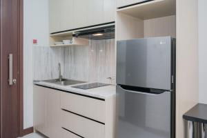 Cozy and Luxury 1BR Apartment at Scientia Residence By Travelio
