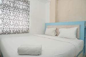 Gorgeous 2BR Green Pramuka Apartment By Travelio