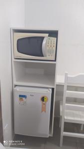 Pousada Quarto Suíte Famíliar com ar,frigobar, wi fi e garagem