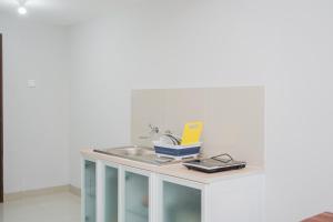 Fully Furnished Studio with Comfort Design Majestic Point Serpong Apartment By Travelio