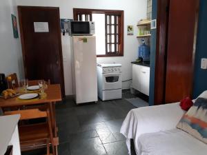 FLAT EM JUQUEHY COM AR COND, PISCINA e CHURRASQUEIRA