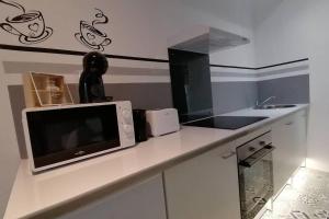 Appartements Maison tout equipee! Avec SALLE DE CINEMA!!! : photos des chambres