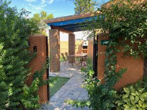 Casita con jardín privado y piscina compartida