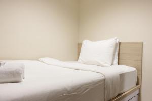 Best Location 2BR Tamansari La Grande Apartment By Travelio