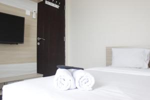 Best Location 2BR Tamansari La Grande Apartment By Travelio