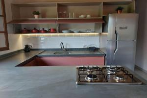 Sapeca - Novo Flat c Piscina, 50mts da praia, churrasqueira privativa, ar con, wi-fi, netflix, garagem