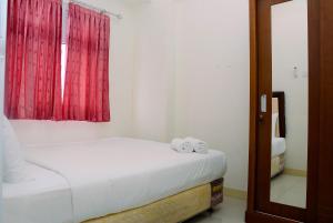 Cozy and Relax 2BR Green Pramuka City Apartment By Travelio