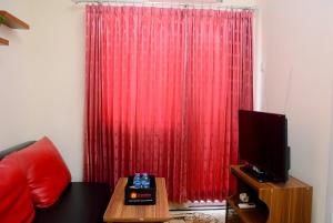 Cozy and Relax 2BR Green Pramuka City Apartment By Travelio