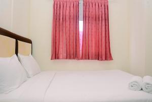 Cozy and Relax 2BR Green Pramuka City Apartment By Travelio