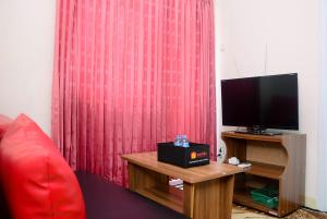 Cozy and Relax 2BR Green Pramuka City Apartment By Travelio