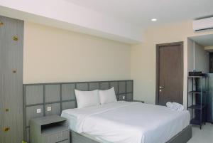 Cozy Studio Apartment at Nine Residence By Travelio