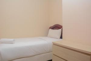 Warm and Cozy 2BR Apartment Woodland Park Residence By Travelio